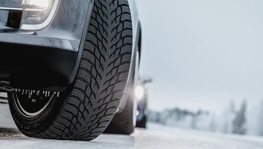 Image of vehicle on winter road with winter tires