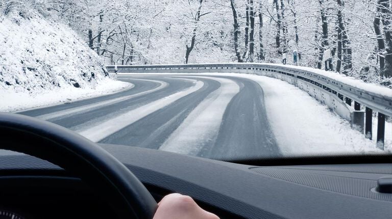 Car driving safely on winter road