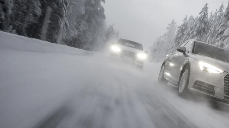 Winter road with vehicles