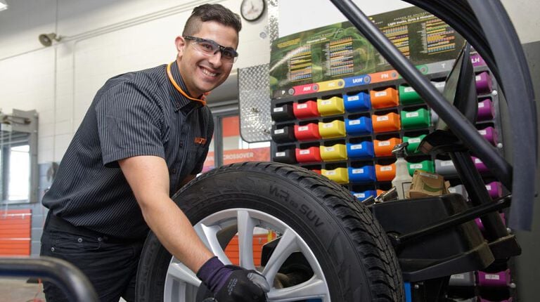 What’s the difference between tire balancing and wheel alignments? Tire on a balancing machine