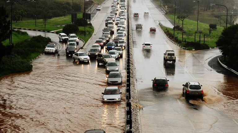 vehicles driving in mud and flooded road