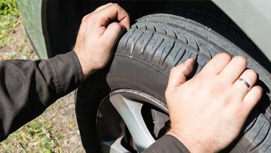 How do you measure tire tread depth?