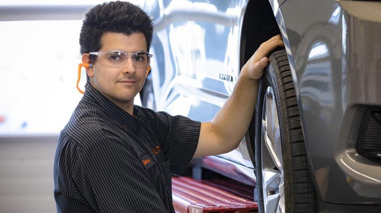 Do you need to rotate winter tires? Kal Tire team member rotating tires