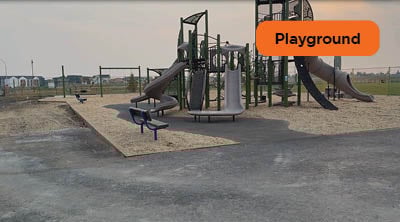 A newly constructed playground with pour-in-place recycled rubber surface.