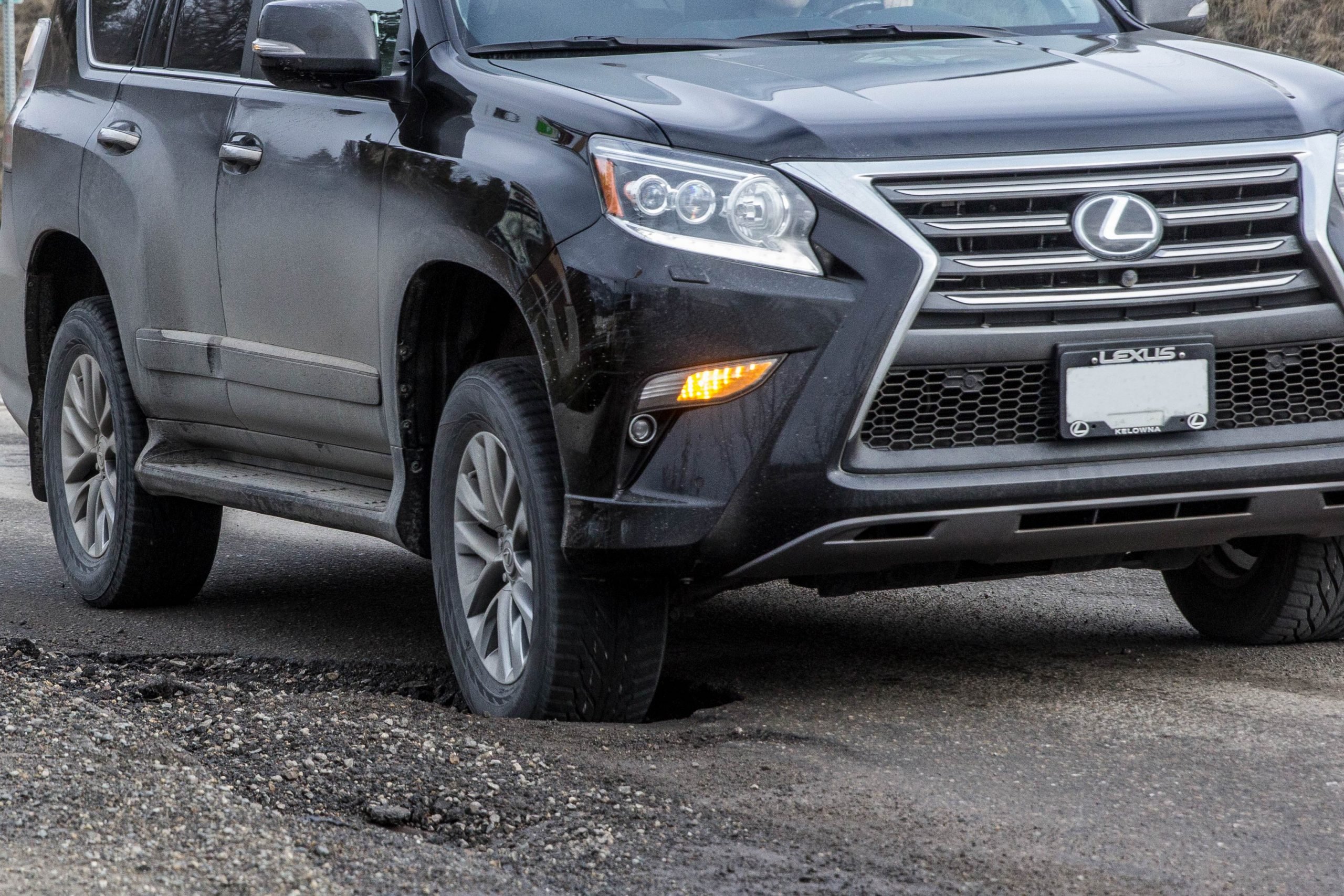 car needing an alignment due to pothole