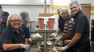 Team members preparing food