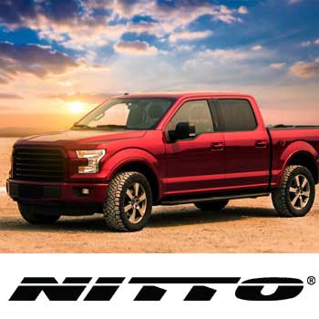 Vehicle driving on road with Nitto tires. Nitto tire special